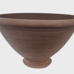 An undecorated garden pot suitable for planting small bulbs such as crocus or snowdrops.
