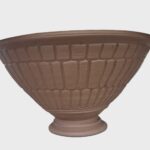 A decorative garden pot suitable for planting small bulbs such as crocus or snowdrops.